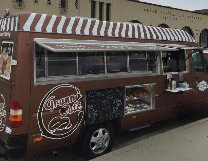 Brown granno cafe mobile truck ready to serve customers in front of the grand central air terminal.