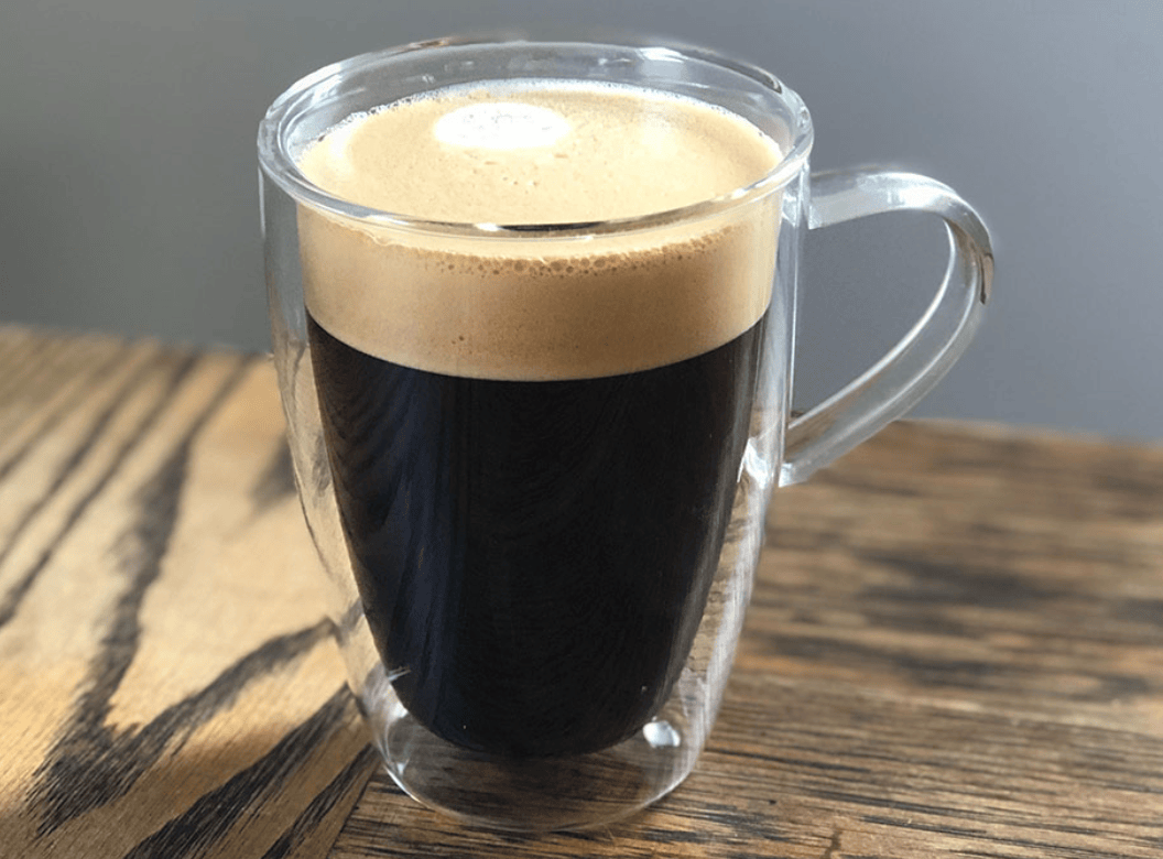 clear cup with dark espresso americano drink