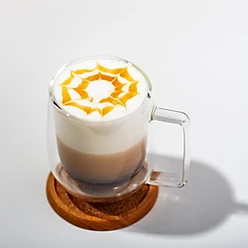 claer cup with latte, foam, and caramel drizzel