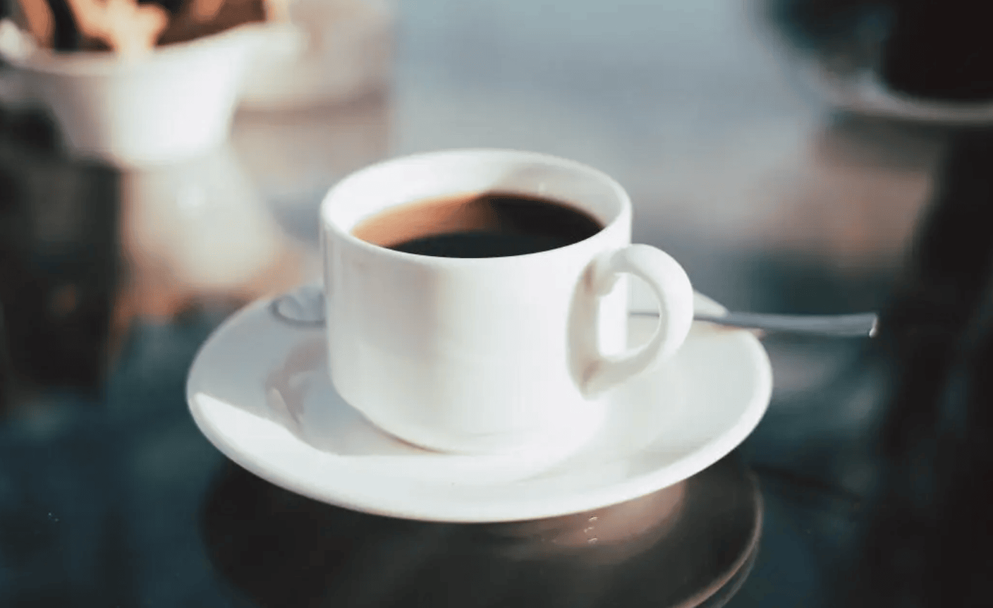 white cup of drip coffee