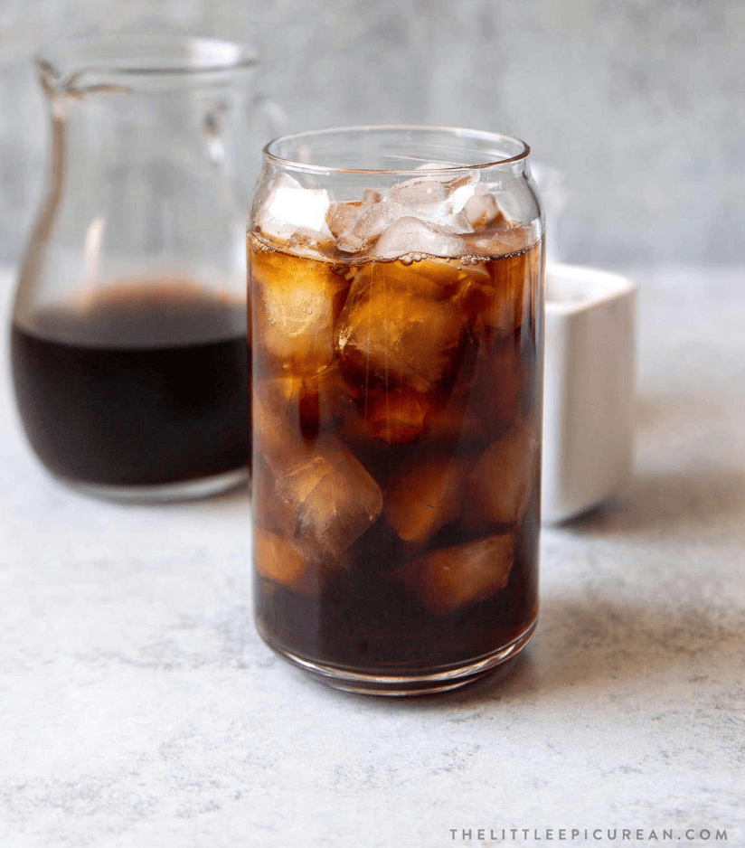 iced cold brew cup with a pitcher in the background
